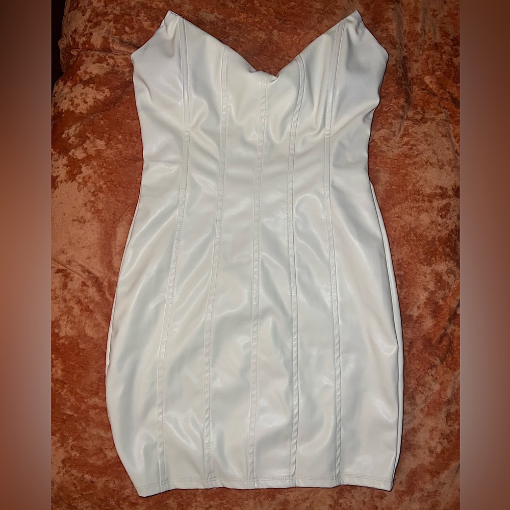 Mini white leather dress.